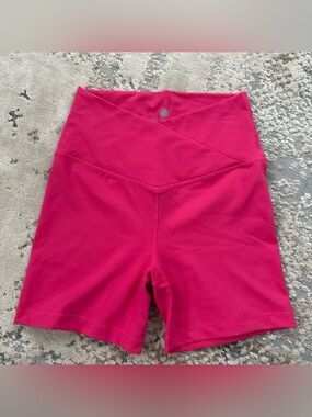 Yogalicious pink crossover workout shorts in size S